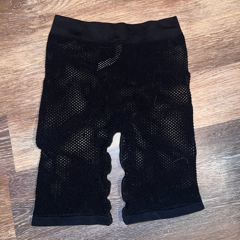 Urban Outfitters out from under fishnet shorts